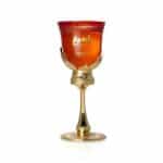 Bahiya Ruby perfume in ornate glass and gold holder, luxury fragrance display.