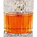 Luxury perfume bottle with intricate glass design and amber fragrance.